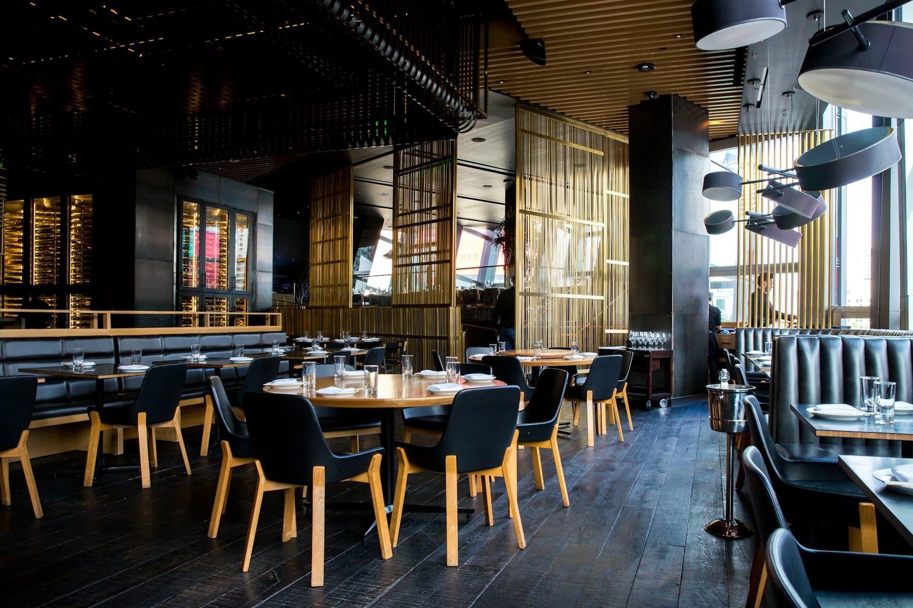 Warm independent restaurant dining room set for service